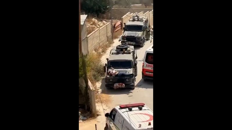  Israeli military straps injured Palestinian man to hood of jeep