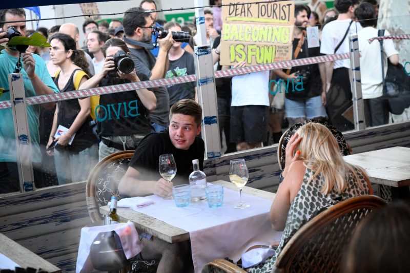  Barcelona protesters throw items and spray travelers with water while shouting ‘tourists go home’