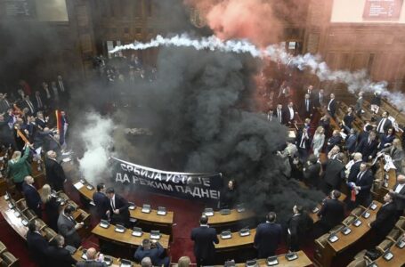 Smoke grenades tossed in Serbian parliament, lawmaker suffers stroke